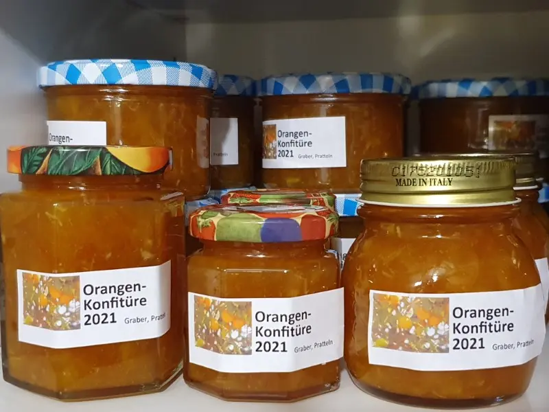 Photo of preserving jars labelled 'Orange jam 2021', gebana.com