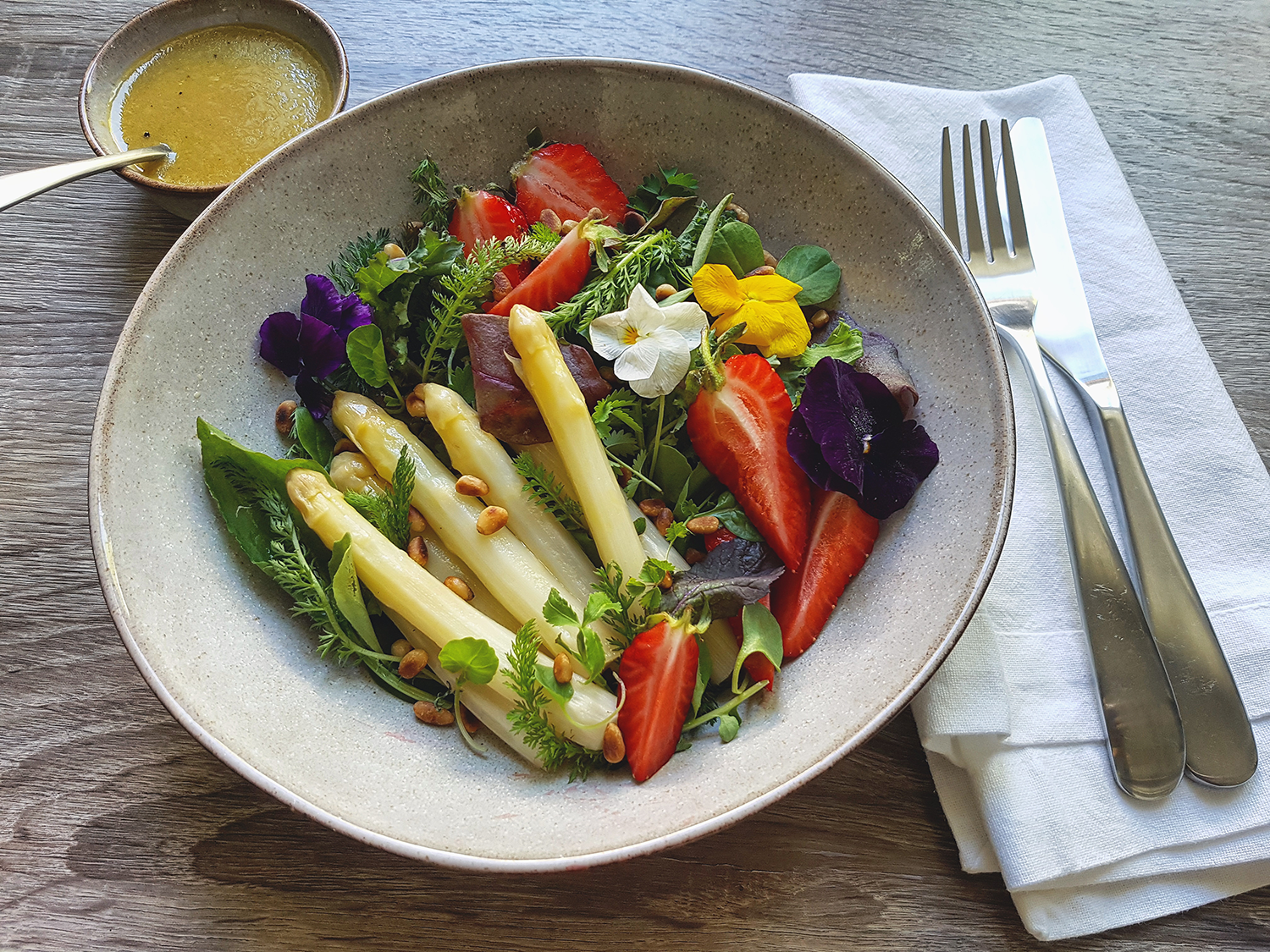 Wild herb salad with oven asparagus